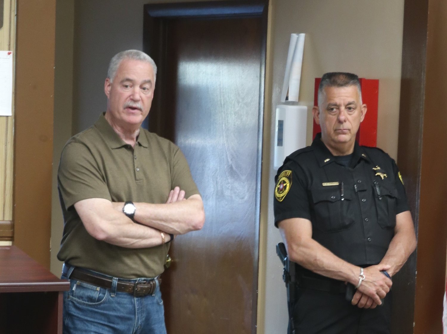 Sheriff Mike Schiff, left, and deputy Paul Pratti were in attendance at the June 14 Town of Highland board meeting. The town is exploring a contract with the sheriff to provide a dedicated police presence for approximately 32 hours a week.